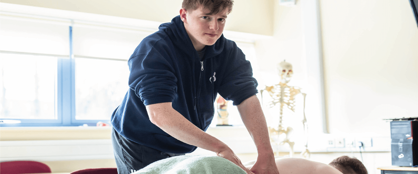 Student giving a sports massage