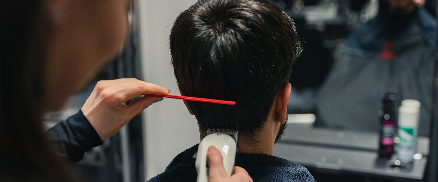 clippers and comb near students hair