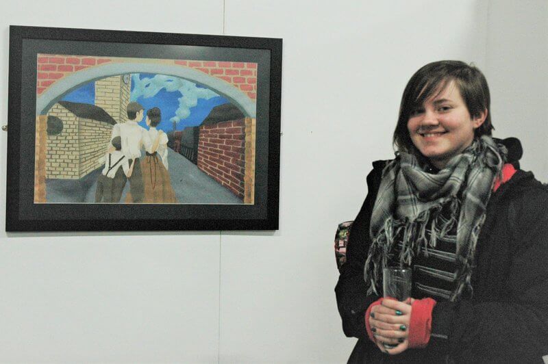 Barnsley College Art and Design student Rebecca Warburton with her artwork on display at Elsecar Heritage Centre.