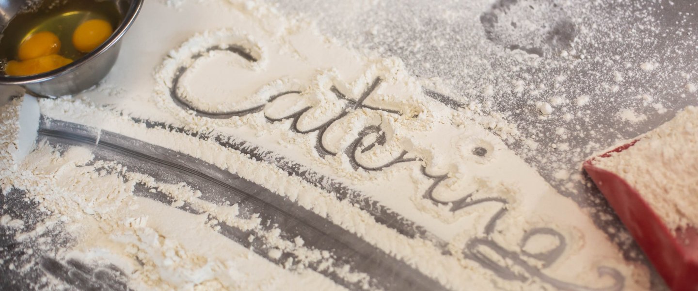 The word catering written in baking flour.