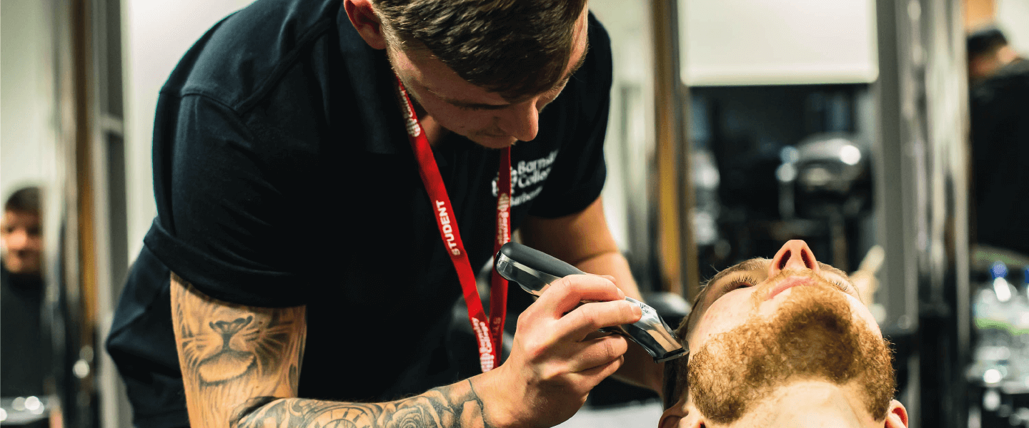 Student shaving a client