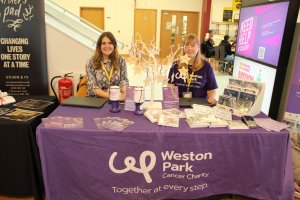 Weston Park Cancer Charity donations table inside Barnsley College atrium