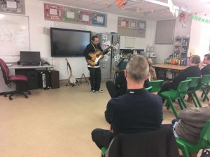 guitar performance in front of students