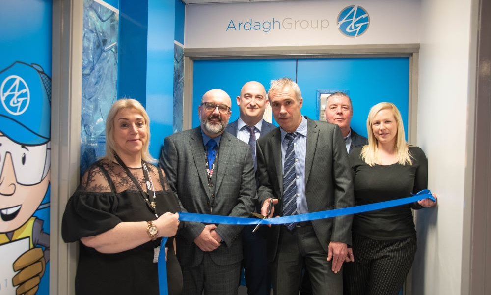 Barnsley College and Ardagh Group Launch new Academy - Six people involved in the launch stood cutting the ribbon infront of the branded Ardagh Group room