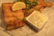 A fish and chips meal in the open kitchen