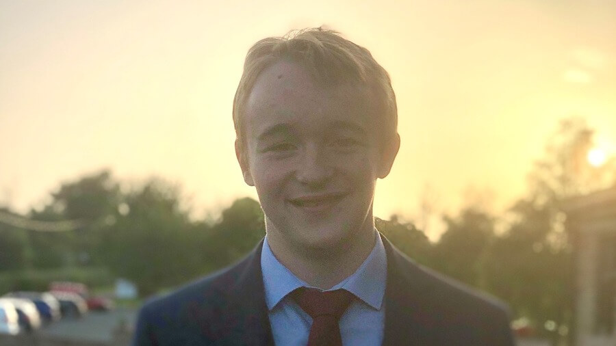 Ethan Sumner wearing a suit and tie