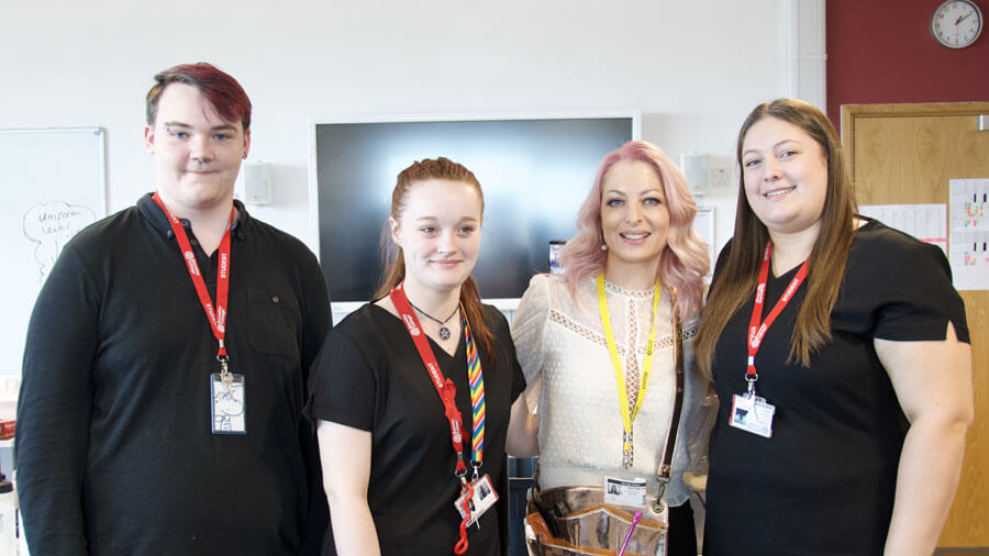 Hairdressing students Toby Lee, Hailie McCann and Rachel Thompson, with Sheree Thompson from Siren Hair Art (second from right)