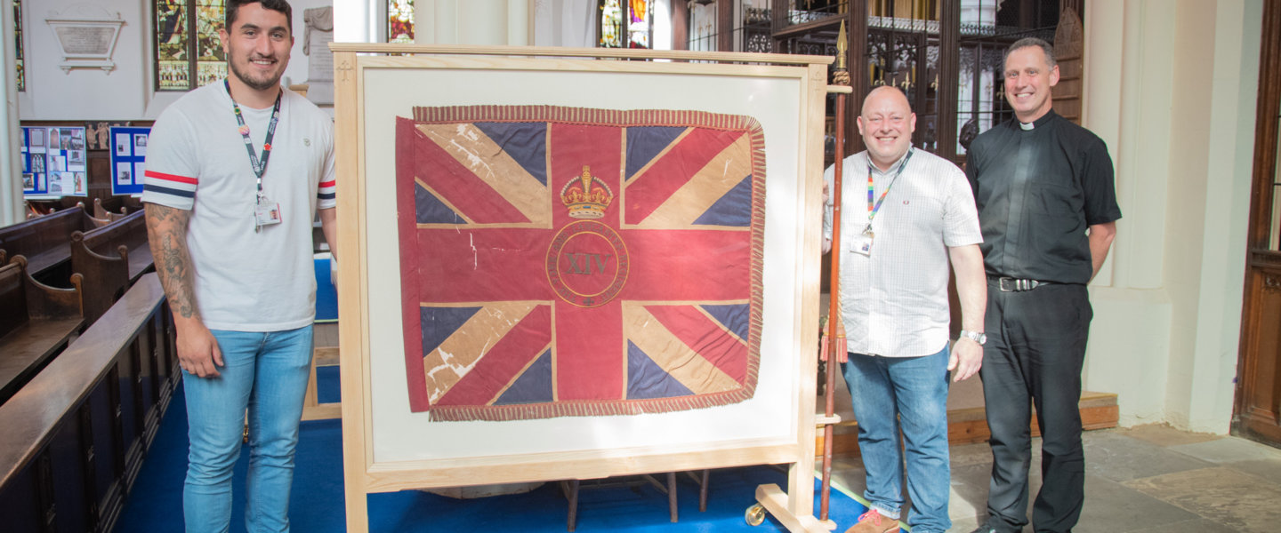 Barnsley College Joinery Lecturers Dom Horn and Stephen Seymour, and Father Stephen Race at St Mary’s Church unveiling the framed flags. 1