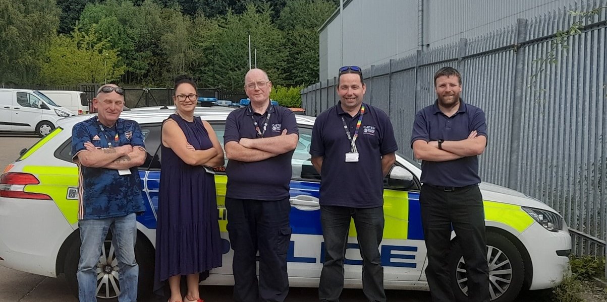 Barnsley College's automotive teaching staff with members of South Yorkshire Police's Vehicle Fleet Department