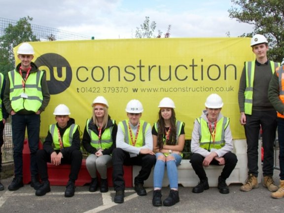 A photo of Construction T Level students and teaching staff at the site of the College’s new £3.5m automotive centre.