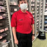 Jak Durose on his internship at Barnsley Hospital wearing a red top and face mask