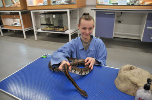 student with snake