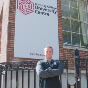 Lliam Dickinson stood in front of Barnsley College University Centre.