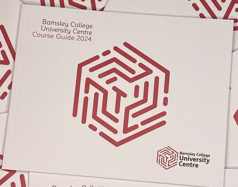 A pile of Higher Education Course Guides 2024