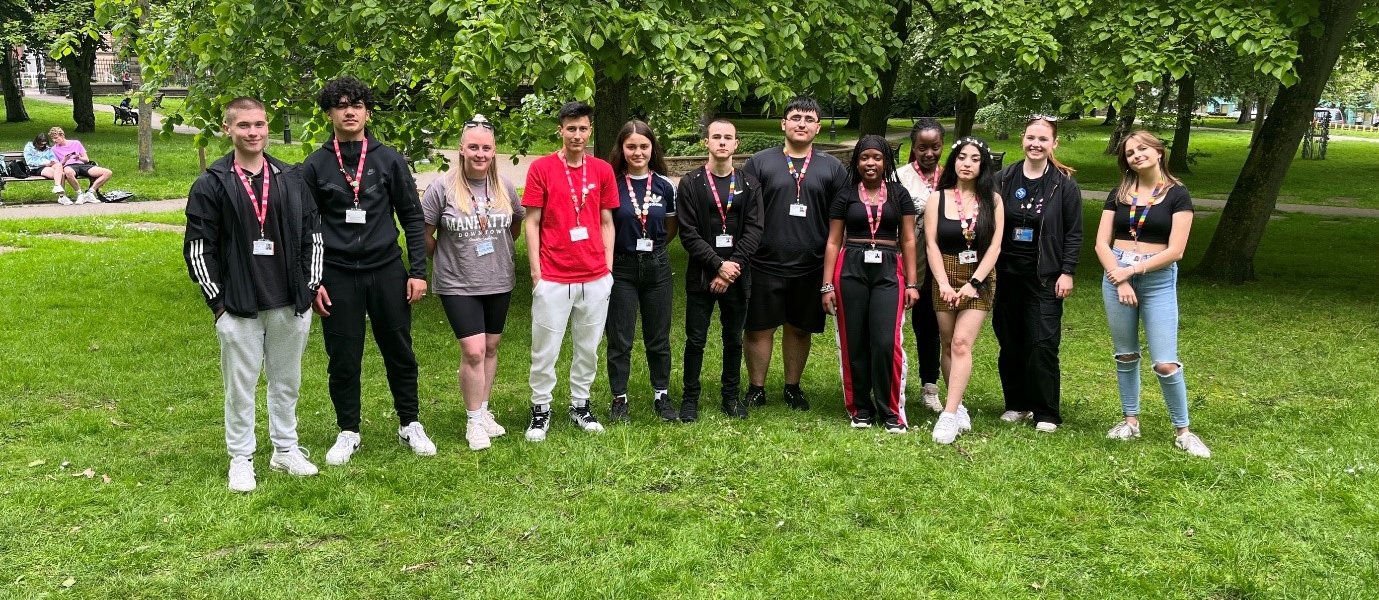 ESOL students who worked on the project all stood together outdoors.