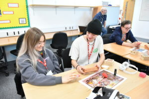 Two Applied Science students considering the differences in medicine packing.