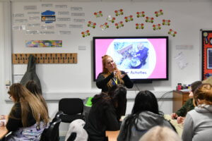 Little Explorers Nursery worker speaking to students.