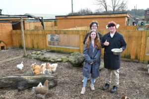 Three Animal Care students with the chickens during the Chicken Talk