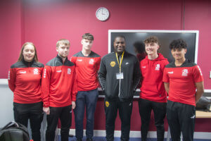 Sports students with record-making former footballer, Bruce Dyer (third from right).