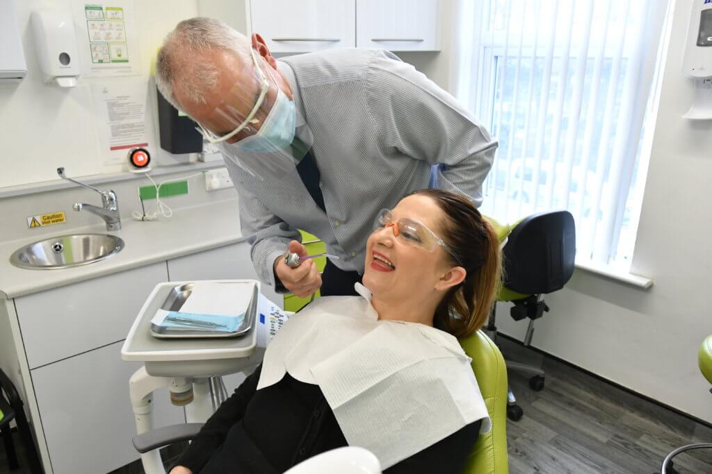 Barnsley College Vice Principal for Curriculum Shaun Cook with Nicola Lovell at Firth Park Dental in Sheffield.