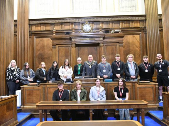 Public Services students stood with Mayor of Barnsley, Cllr James Michael Stowe in the Council Chambers.
