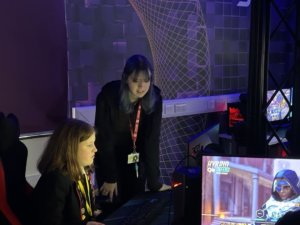 A female Esports student with a female TASE student receiving coaching.