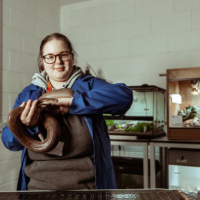 Animal Management Foundation Degree student, Katy Key, with a snake in the Retile Room at Wigfield Farm