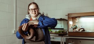 Animal Management Foundation Degree student, Katy Key, with a snake in the Retile Room at Wigfield Farm