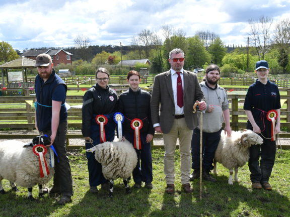 A group of Level 3 Animal Care (Practical Skills) students with Richard Walker (third from right) and their prize-winning sheep.